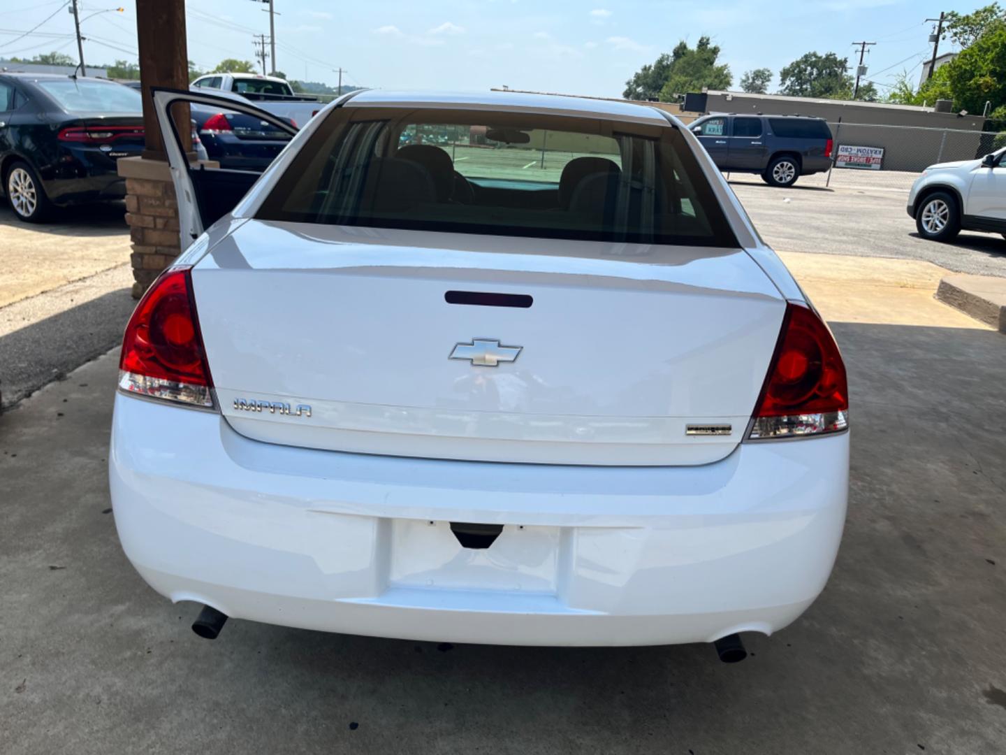 2012 White Chevrolet Impala LS (Fleet) (2G1WF5E31C1) with an 3.6L V6 DOHC 16V FFV engine, 6-Speed Automatic transmission, located at 307 West Marshall Avenue, Longview, TX, 75601, (903) 753-3091, 32.500828, -94.742577 - Photo#2