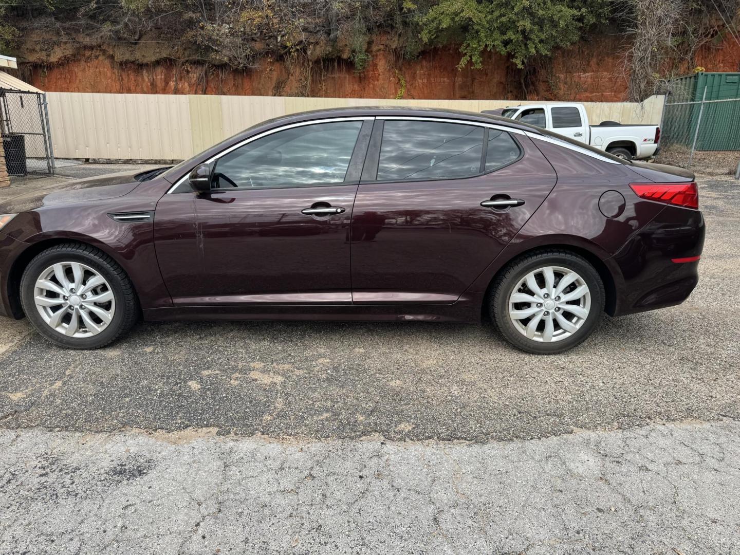 2014 Maroon Kia Optima LX (5XXGM4A71EG) with an 2.4L L4 DOHC 16V engine, 6-Speed Automatic transmission, located at 307 West Marshall Avenue, Longview, TX, 75601, (903) 753-3091, 32.500828, -94.742577 - Photo#1