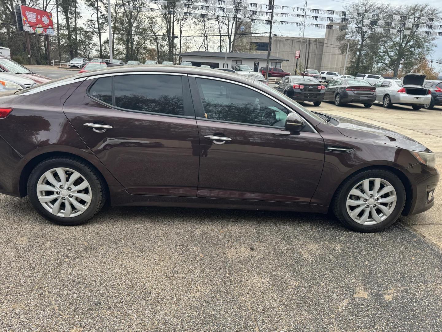 2014 Maroon Kia Optima LX (5XXGM4A71EG) with an 2.4L L4 DOHC 16V engine, 6-Speed Automatic transmission, located at 307 West Marshall Avenue, Longview, TX, 75601, (903) 753-3091, 32.500828, -94.742577 - Photo#2