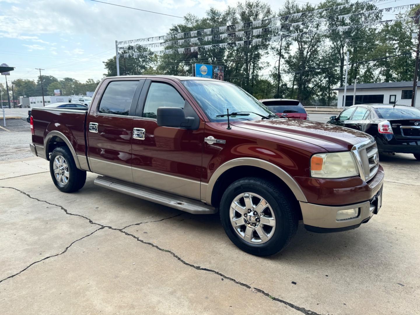 2005 Maroon Ford F-150 Lariat SuperCrew 2WD (1FTPW12525K) with an 5.4L V6 SOHC 16V engine, 4-Speed Automatic Overdrive transmission, located at 307 West Marshall Avenue, Longview, TX, 75601, (903) 753-3091, 32.500828, -94.742577 - Photo#1