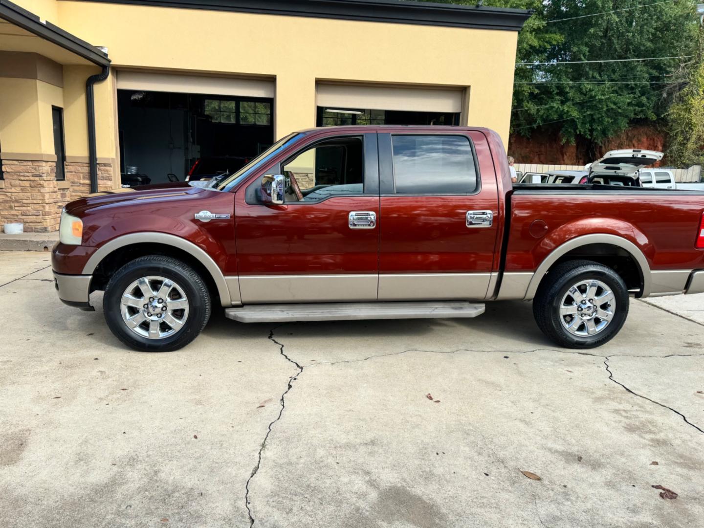 2005 Maroon Ford F-150 Lariat SuperCrew 2WD (1FTPW12525K) with an 5.4L V6 SOHC 16V engine, 4-Speed Automatic Overdrive transmission, located at 307 West Marshall Avenue, Longview, TX, 75601, (903) 753-3091, 32.500828, -94.742577 - Photo#2