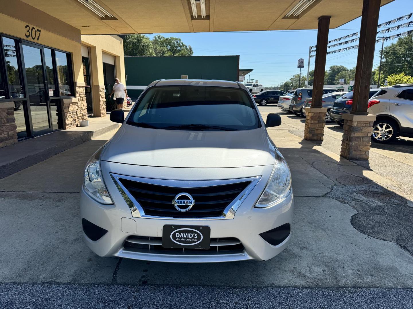 2015 SILVER Nissan Versa 1.6 S 5M (3N1CN7AP0FL) with an 1.6L L4 DOHC 16V engine, 5-Speed Manual transmission, located at 307 West Marshall Avenue, Longview, TX, 75601, (903) 753-3091, 32.500828, -94.742577 - Photo#0