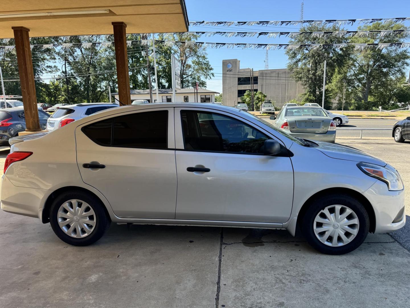 2015 SILVER Nissan Versa 1.6 S 5M (3N1CN7AP0FL) with an 1.6L L4 DOHC 16V engine, 5-Speed Manual transmission, located at 307 West Marshall Avenue, Longview, TX, 75601, (903) 753-3091, 32.500828, -94.742577 - Photo#1