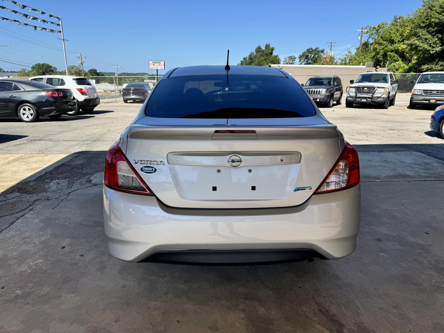 2015 SILVER Nissan Versa 1.6 S 5M (3N1CN7AP0FL) with an 1.6L L4 DOHC 16V engine, 5-Speed Manual transmission, located at 307 West Marshall Avenue, Longview, TX, 75601, (903) 753-3091, 32.500828, -94.742577 - Photo#3