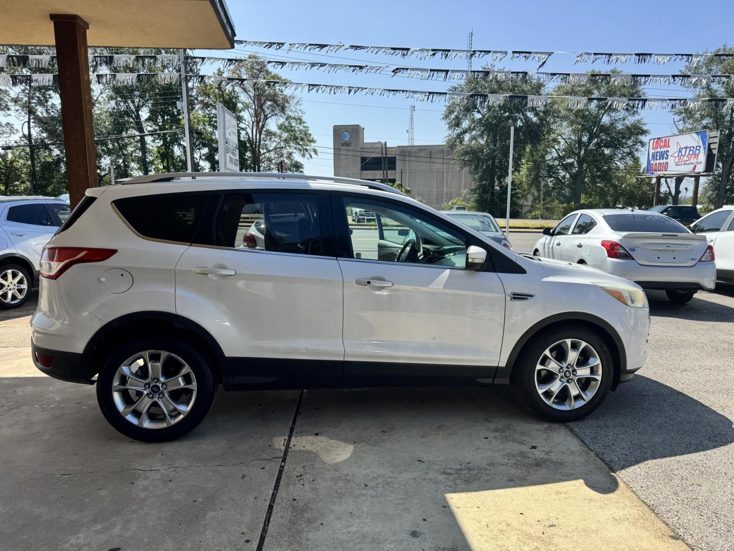 2014 White Ford Escape Titanium FWD (1FMCU0J96EU) with an 2.0L L4 DOHC 16V engine, 6-Speed Automatic transmission, located at 307 West Marshall Avenue, Longview, TX, 75601, (903) 753-3091, 32.500828, -94.742577 - Photo#0