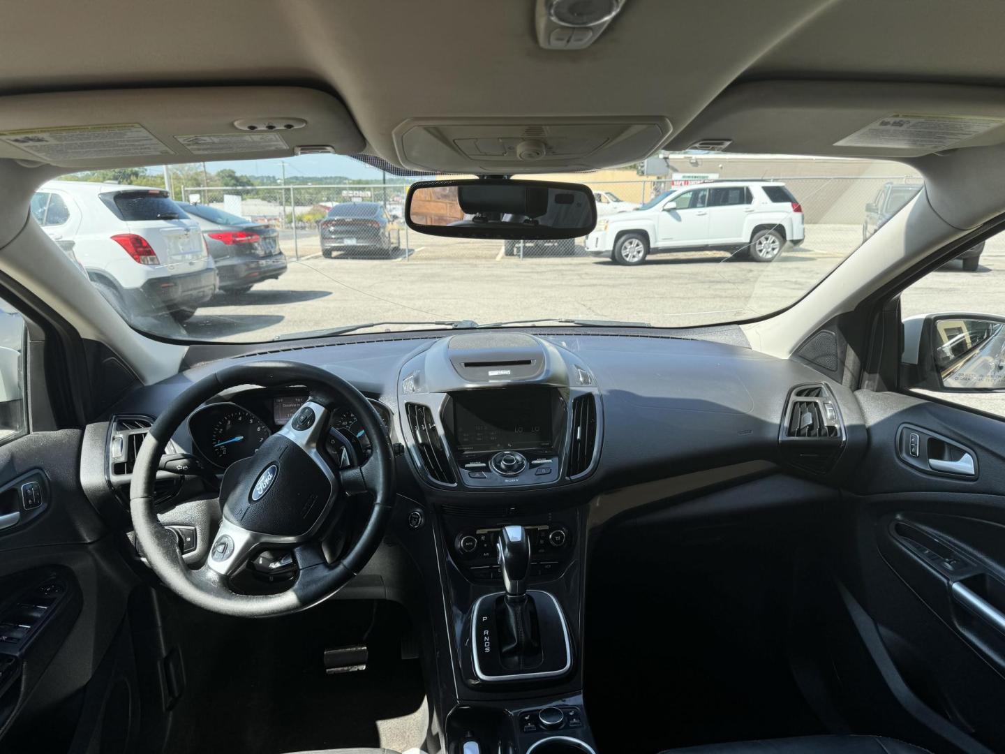 2014 White Ford Escape Titanium FWD (1FMCU0J96EU) with an 2.0L L4 DOHC 16V engine, 6-Speed Automatic transmission, located at 307 West Marshall Avenue, Longview, TX, 75601, (903) 753-3091, 32.500828, -94.742577 - Photo#5