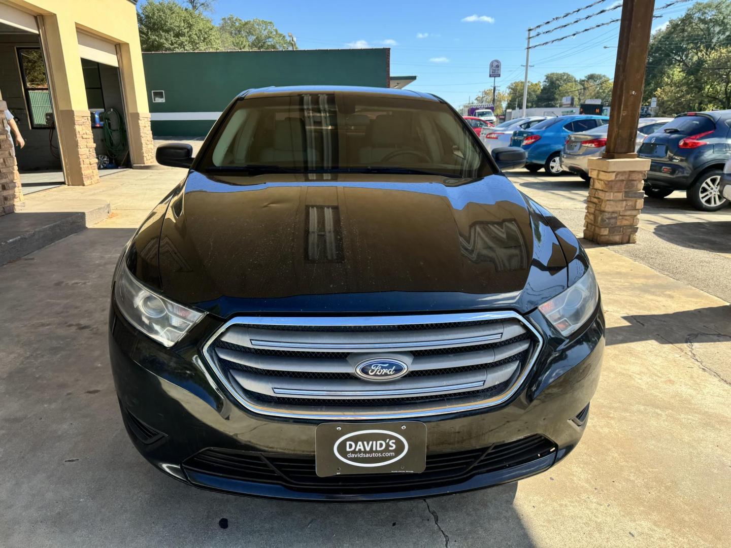 2014 BLACK Ford Taurus SE FWD (1FAHP2D82EG) with an 3.5L V6 DOHC 24V engine, 6-Speed Automatic transmission, located at 307 West Marshall Avenue, Longview, TX, 75601, (903) 753-3091, 32.500828, -94.742577 - Photo#0