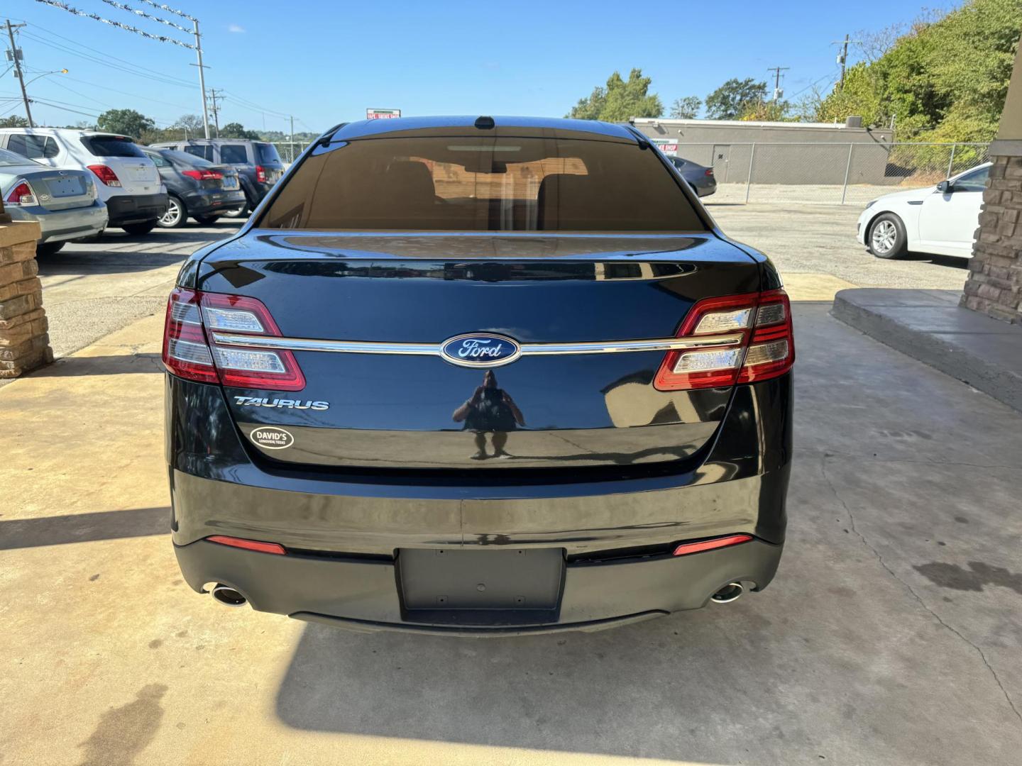 2014 BLACK Ford Taurus SE FWD (1FAHP2D82EG) with an 3.5L V6 DOHC 24V engine, 6-Speed Automatic transmission, located at 307 West Marshall Avenue, Longview, TX, 75601, (903) 753-3091, 32.500828, -94.742577 - Photo#1