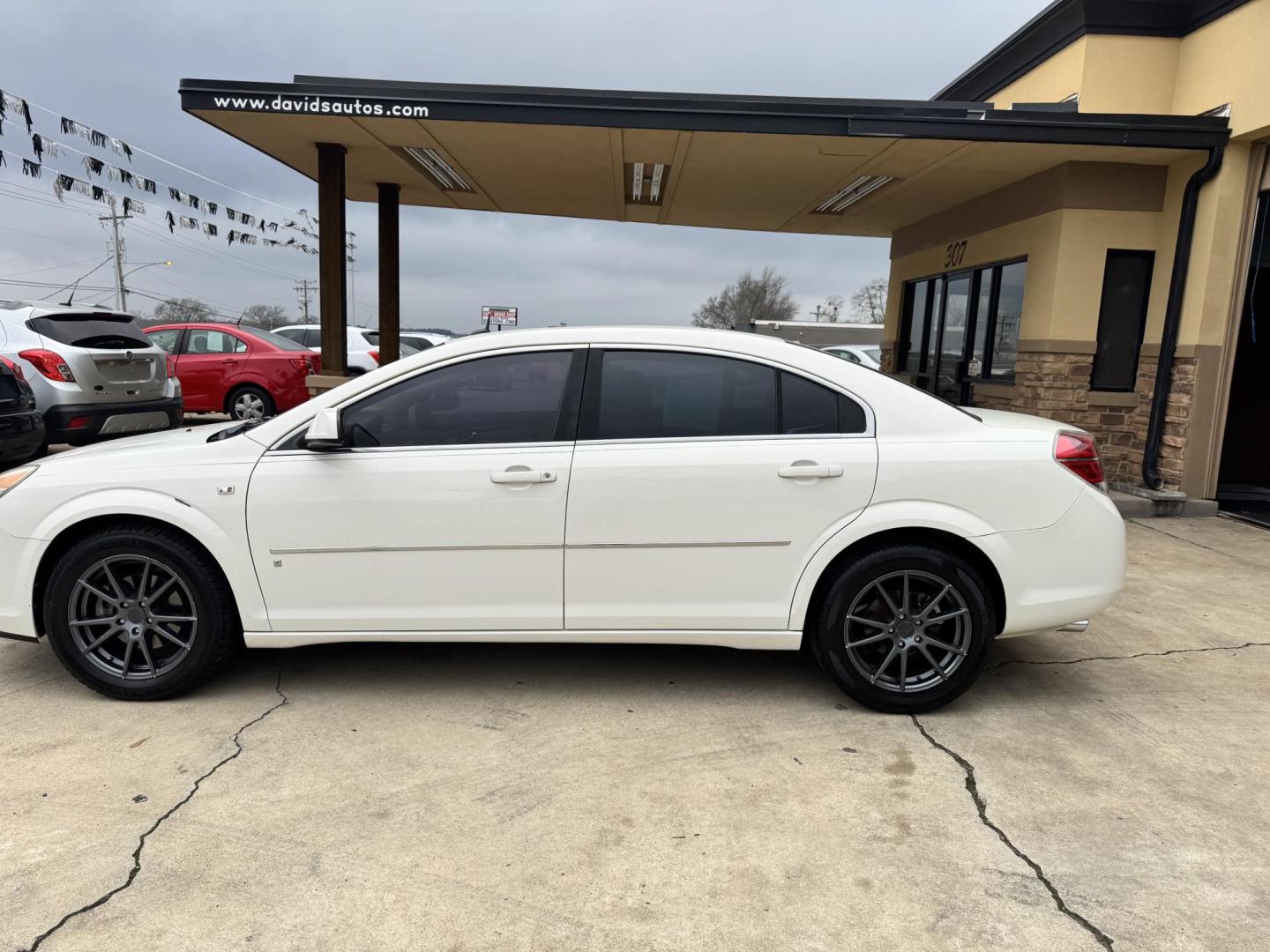 2007 White Saturn Aura XE (1G8ZS57N37F) with an 3.5L V6 12V OHV engine, 4-Speed Automatic Overdrive transmission, located at 307 West Marshall Avenue, Longview, TX, 75601, (903) 753-3091, 32.500828, -94.742577 - Photo#1