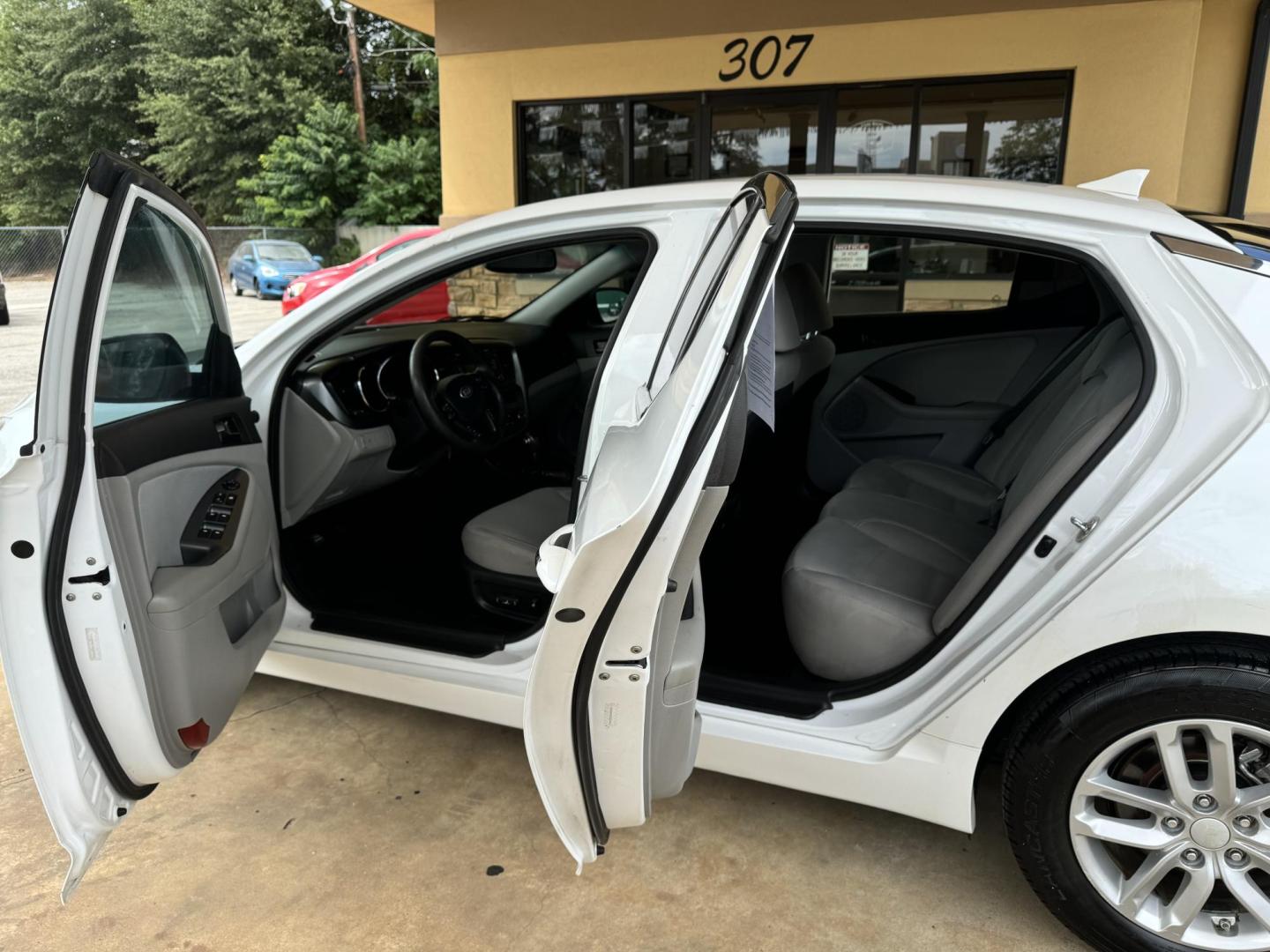 2013 White Kia Optima LX MT (5XXGM4A74DG) with an 2.4L L4 DOHC 16V engine, located at 307 West Marshall Avenue, Longview, TX, 75601, (903) 753-3091, 32.500828, -94.742577 - Photo#4